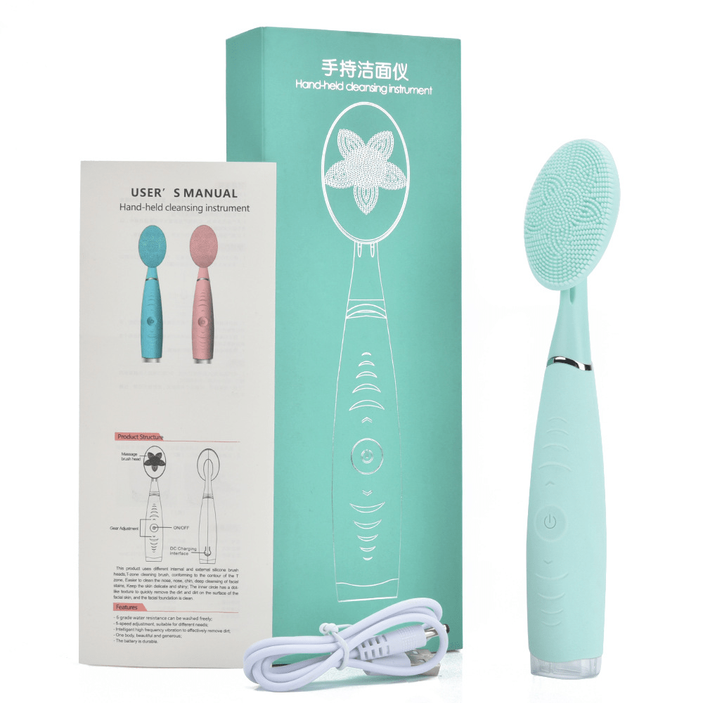 Pink and teal facial cleansing brush packaging with charging cable, shown side by side