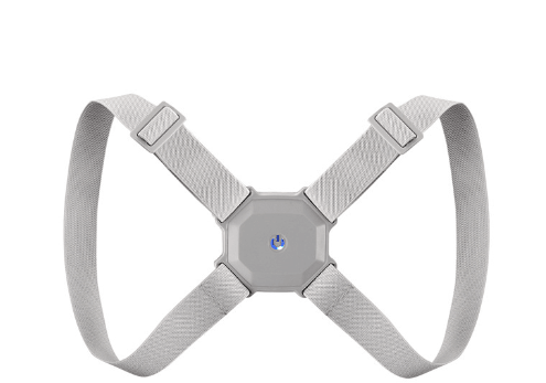 Grey figure-8 posture corrector strap laid flat, showing adjustable straps and central sensor